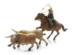 5870170_Cowboy_vangt_Longhorns_met_lasso_h_LR